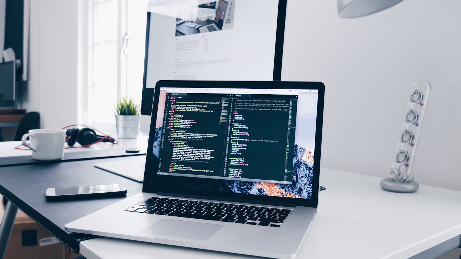 Developer laptop with modern web project code
